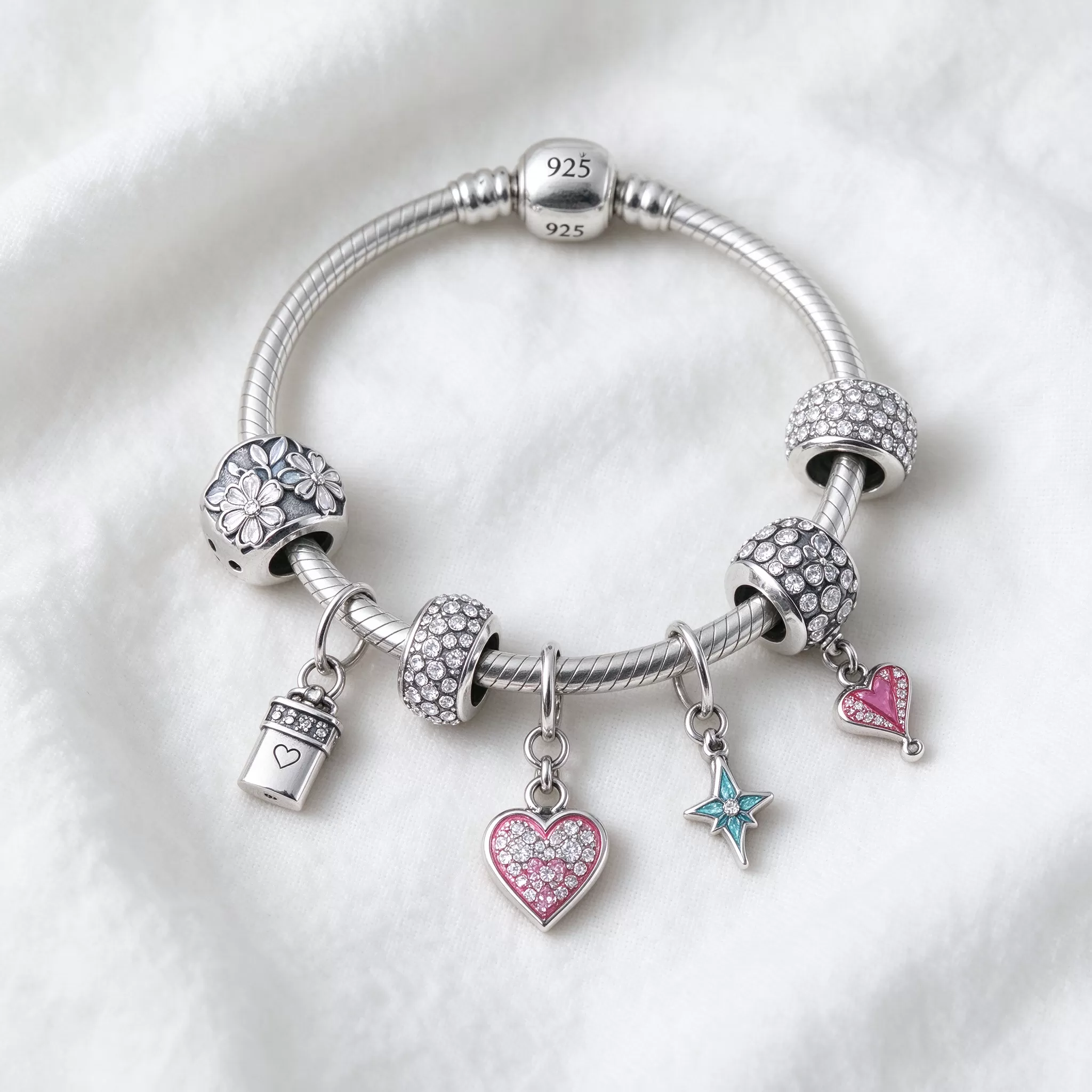 How charms attach to a silver bracelet Sterling silver charm bracelet with attached charms